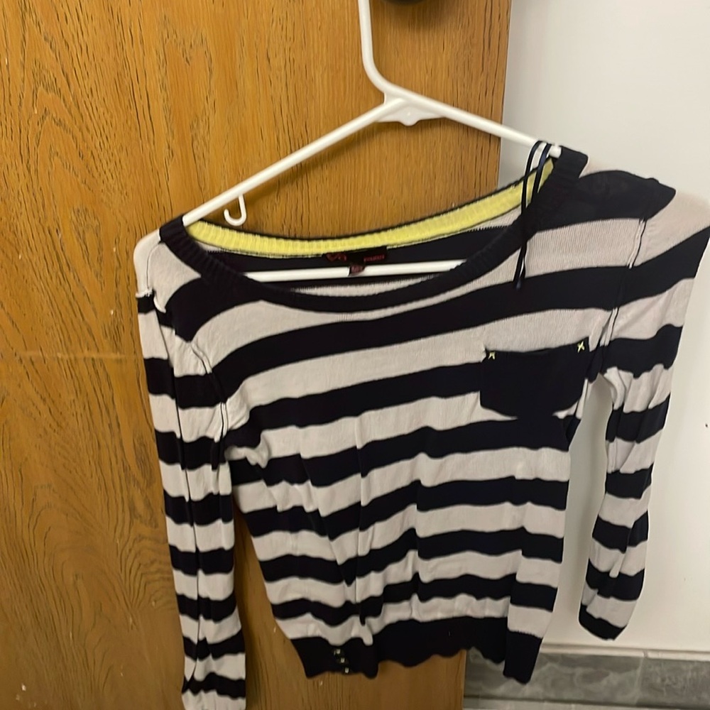 This a blue and Grey Sweater.